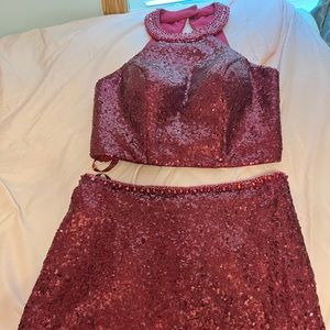Two piece maroon dress, beautiful beads around the neck and the waist. Size 6